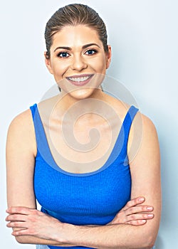 Smiling sporty woman portrait with crossed arms