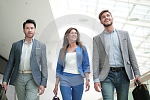 Smiling staff walking in the business center.