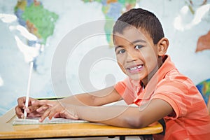 Smiling student doing class work