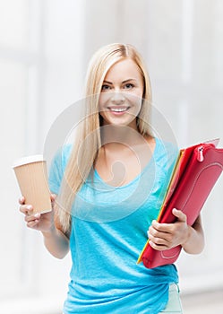 Smiling student with folders
