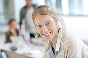 Smiling student girl attending class