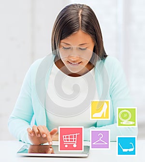 Smiling student girl with tablet pc blogging