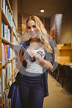 Smiling student using her tablet
