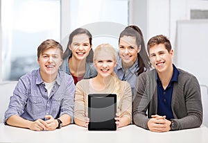 Smiling students with blank tablet pc screen