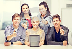 Smiling students with blank tablet pc screen