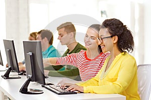 Smiling students in computer class at school