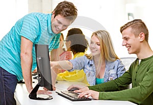 Smiling students in computer class at school