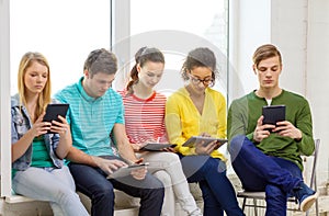 Smiling students with tablet pc computer