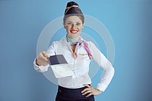 smiling stylish air hostess woman on blue