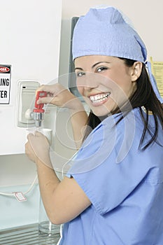 Smiling surgeon making drink