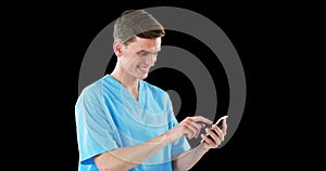 Smiling surgeon using mobile phone