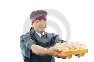 Smiling sushi chef
