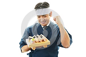 Smiling sushi chef