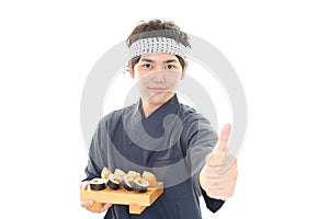 Smiling sushi chef