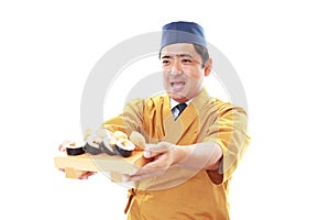 Smiling sushi chef