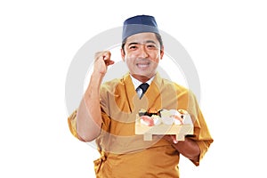 Smiling sushi chef