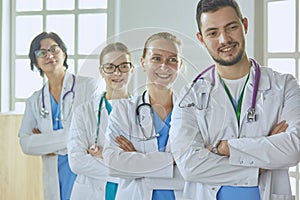 Smiling team of doctors and nurses at hospital