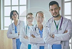 Smiling team of doctors and nurses at hospital