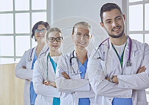 Smiling team of doctors and nurses at hospital