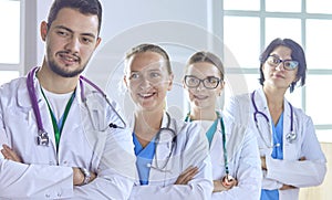 Smiling team of doctors and nurses at hospital