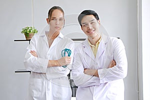 Smiling teamwork and smart of Young Caucasian Female and Asian male psychiatrist are specialist in psychiatry in Clinical photo