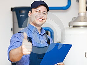 Smiling technician repairing thumbs up