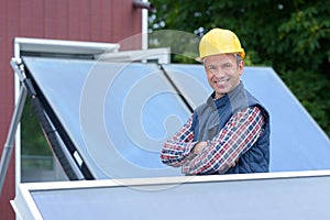 Smiling technician solar panels