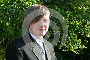 Smiling Teen Boy In Black Tuxedo Horizontal