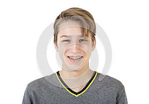 Smiling teen boy with orthodontic braces