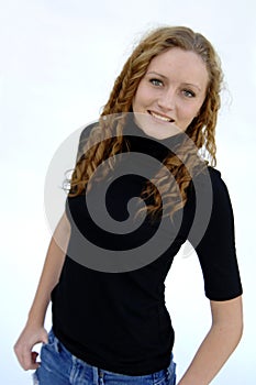 Smiling teen with curly hair