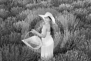 smiling teen girl with lavender in field. Teen girl with lavender flower standing in the field. teen girl with lavender