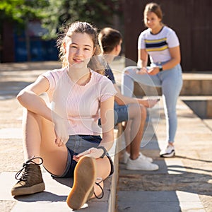 Smiling teen girl outdoors on sunny summer day