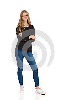 Smiling Teen Girl Is Standing With Arms Crossed