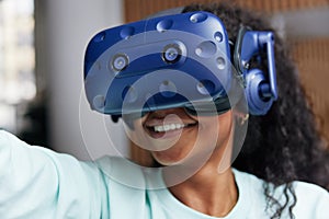 Smiling teen girl wearing a vr headset