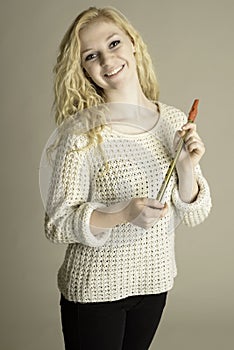 Smiling teen holding pennywhistle