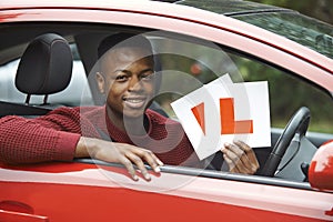 Smiling Teenage Boy In Car Passing Driving Exam