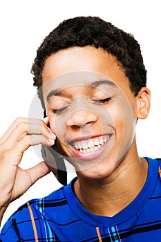 Smiling Teenage Boy Using Phone