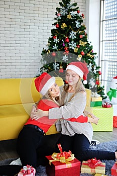 Smiling of Teenage. Caucasian couple girls friends hugging and happy together in Christmas and newyear party. Life style of