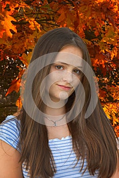 Smiling teenage girl  in autumnal nature