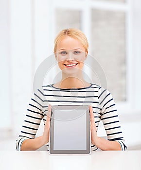 Smiling teenage girl with blank tablet pc screen