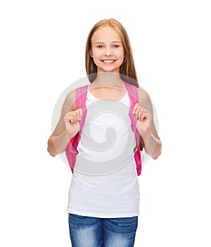 Smiling teenage girl in blank white tank top