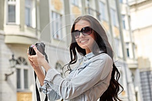 Smiling teenage girl with camera