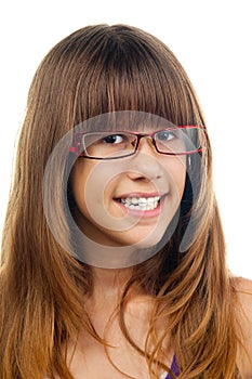 Smiling teenage girl with glasses and dentures