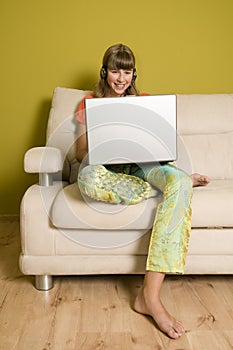 Smiling teenage girl with laptop