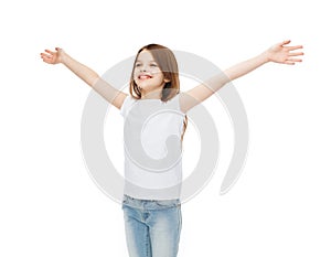 Smiling teenage girl with raised hands