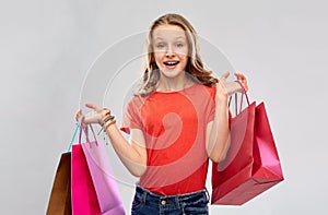 Smiling teenage girl with shopping bags