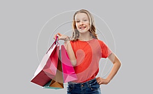 Smiling teenage girl with shopping bags