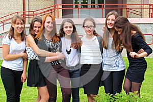 Smiling Teenage Girls front of the School