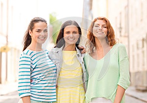 Smiling teenage girls with on street