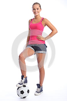 Smiling teenage sports girl with soccer ball